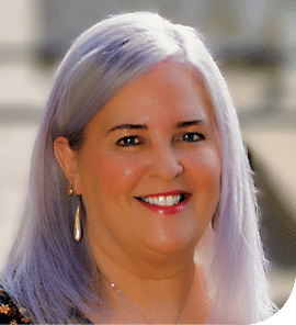 A headshot of Sarah Short smiling face on to camera