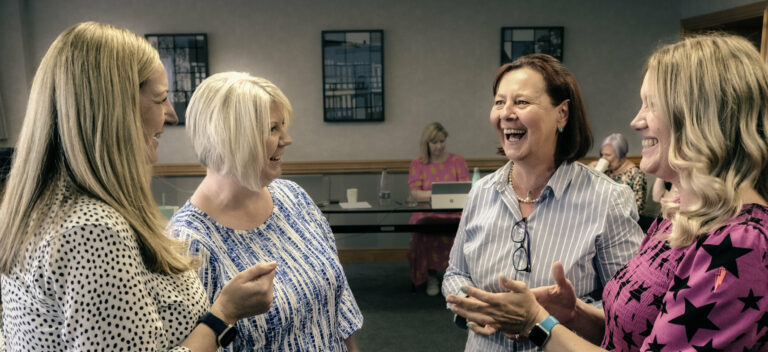 Group of ladies laughing and chatting