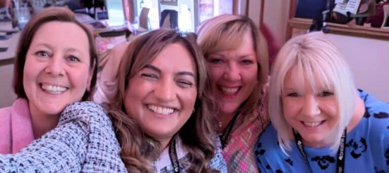 Picture of four smiling ladies - life-friendly HR career