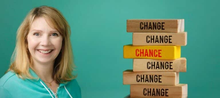 Image of Eleanor next to building blocks with 'Change' on them. career change for HR professionals