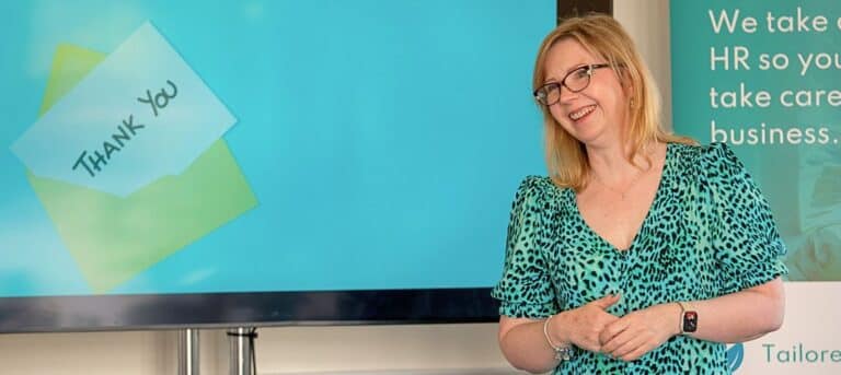 Photo of Eleanor Deem in front of a screen - HR franchise