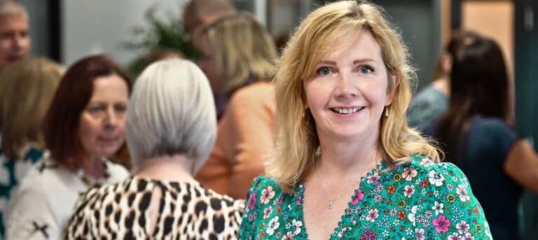 Photo of Eleanor Deem with consultants in the background - support for HR consultants