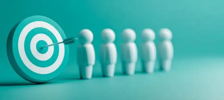 Image of pins that look like people standing by a board with a target and arrow sticking out - finding your hr niche