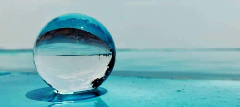Image of a crystal ball on a sea of aqua water - hr career change