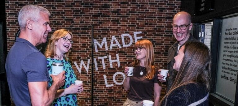 Image of a group of people chatting - confident business decisions