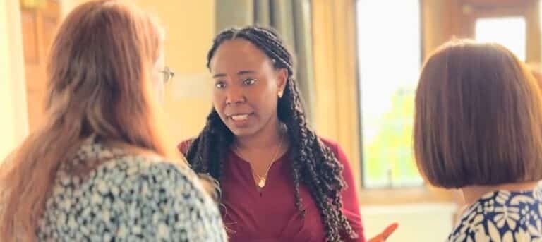Image of three consultants talking - business owner mindset